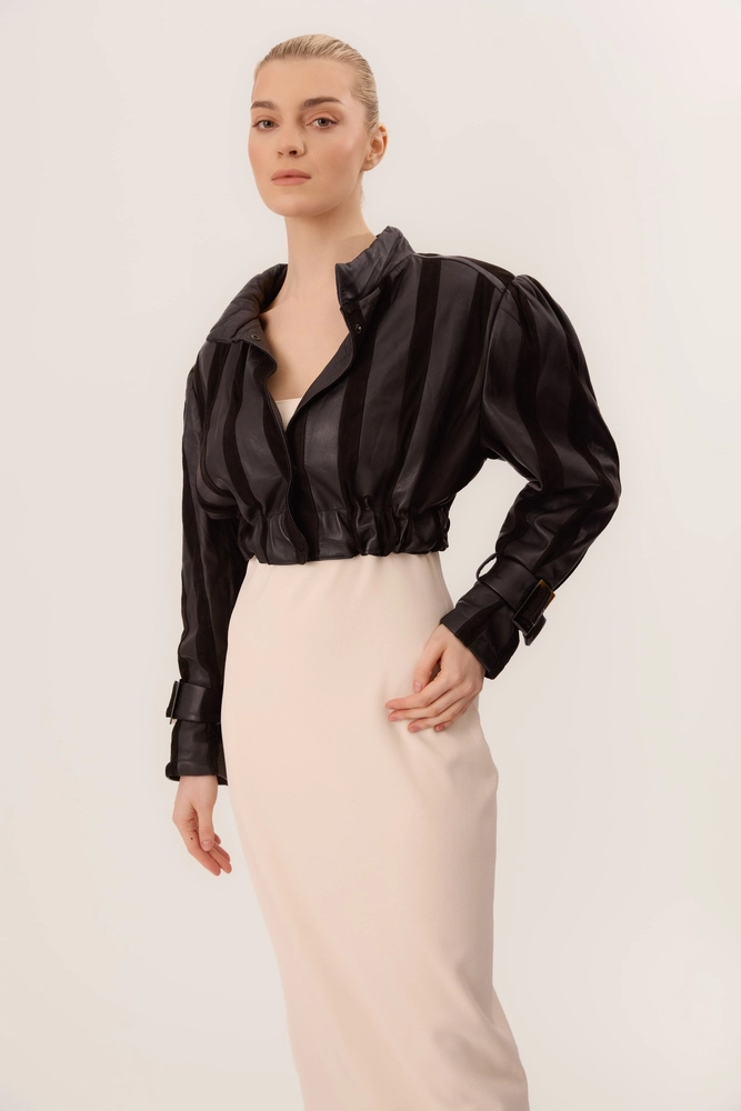 BLACK SHORT LEATHER JACKET WITH ELASTIC WAIST AND BUCKLES ON THE SLEEVES