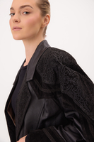 BLACK LEATHER FITTED COAT WITH DECORATIVE VELVET INSERTS
