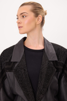 BLACK LEATHER FITTED COAT WITH DECORATIVE VELVET INSERTS
